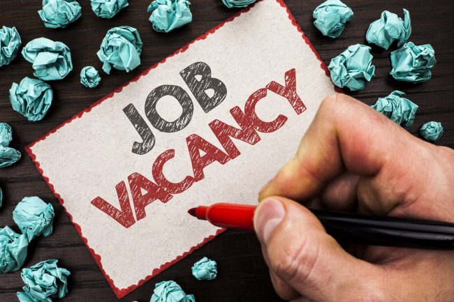 Text sign showing Job Vacancy. Conceptual photo Work Career Vacant Position Hiring Employment Recruit Job written by Man Holding Marker on Cardboard Piece on the wooden background.