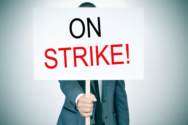 young man in suit on strike