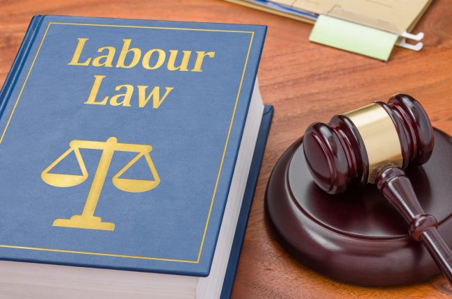 A law book with a gavel – Labour law