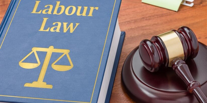 A law book with a gavel – Labour law