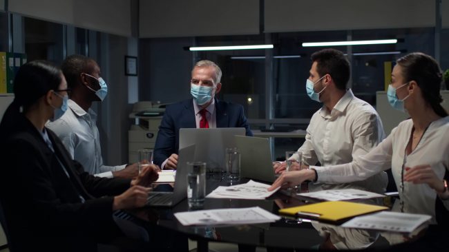 Multiethnic,Business,Partners,In,Safety,Mask,Gather,In,Board,Room