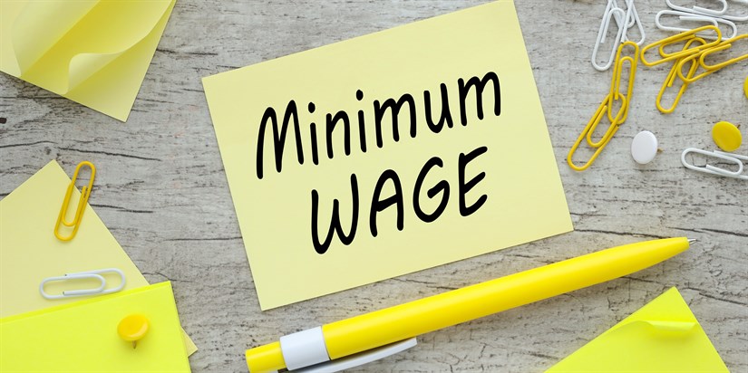 Minimum,Wage,On,Paper,Sticker,Near,Paperclips