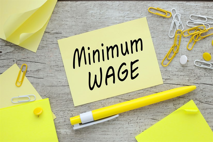Minimum,Wage,On,Paper,Sticker,Near,Paperclips